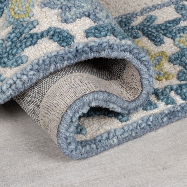 Niebiesko-kremowy dywan z mieszanki wełny tkany ręcznie 120x170 cm Myla Floral Frame – Flair Rugs