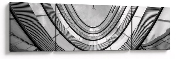 Obraz - Samolot nad budynkiem (170x50 cm)