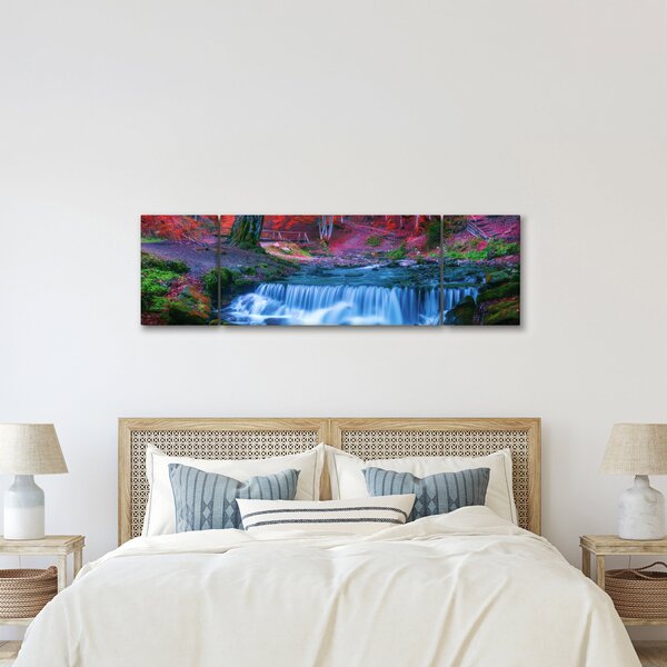Obraz wodospadu w czerwonym lesie (170x50 cm)