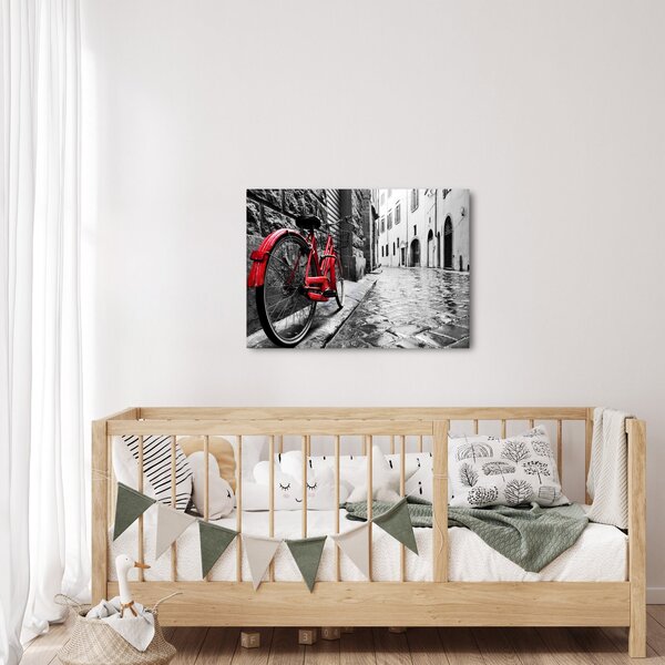 Obraz czerwonego roweru na brukowanej uliczce (70x50 cm)