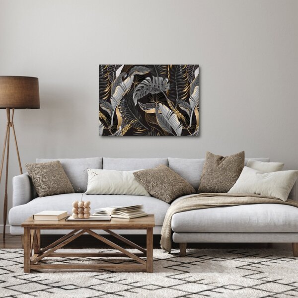 Obraz - Tropikalne liście w kolorze czarno - złotym (70x50 cm)