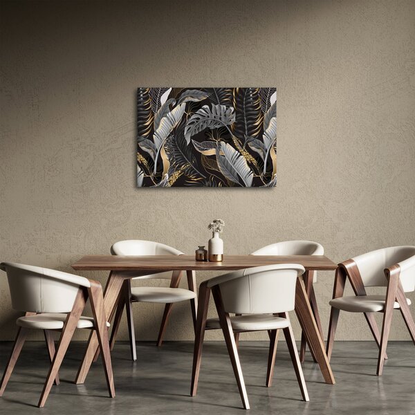 Obraz - Tropikalne liście w kolorze czarno - złotym (70x50 cm)