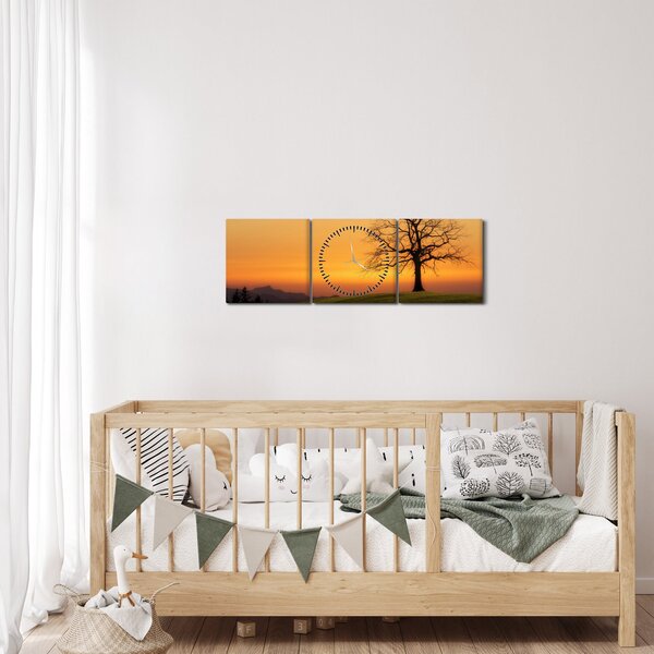 Obraz zachodu słońca na łące (z zegarem) (90x30 cm)