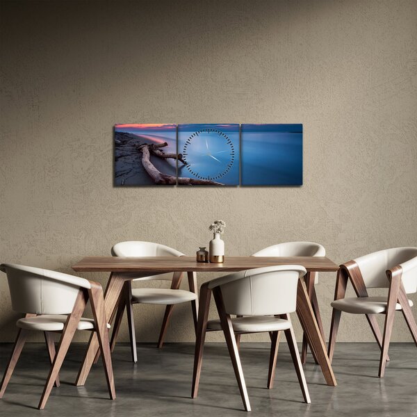 Obraz plaży o zachodzie słońca (z zegarem) (90x30 cm)