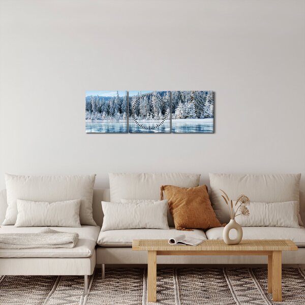 Obraz zamarzniętego jeziora i pokrytych śniegiem drzew (z zegarem) (90x30 cm)