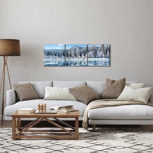 Obraz zamarzniętego jeziora i pokrytych śniegiem drzew (z zegarem) (90x30 cm)