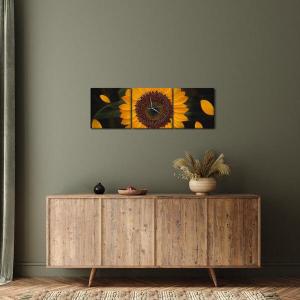 Obraz - Słonecznik i płatki kwiatów (z zegarem) (90x30 cm)