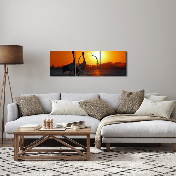 Obraz ptaków o zachodzie słońca (z zegarem) (90x30 cm)