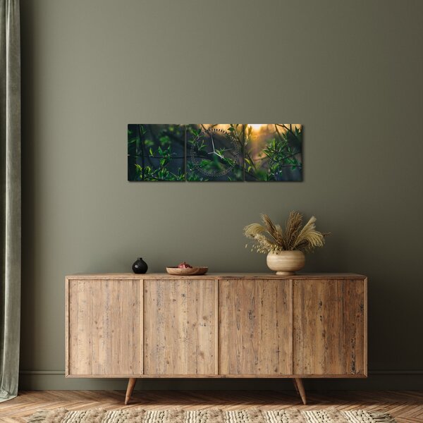 Obraz słońca przeświecającego przez gałęzie drzew (z zegarem) (90x30 cm)