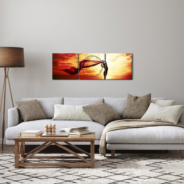 Obraz - Sylwetka kobiety o zachodzie słońca (z zegarem) (90x30 cm)