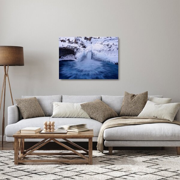 Obraz na szkle wodospadu zimą (70x50 cm)