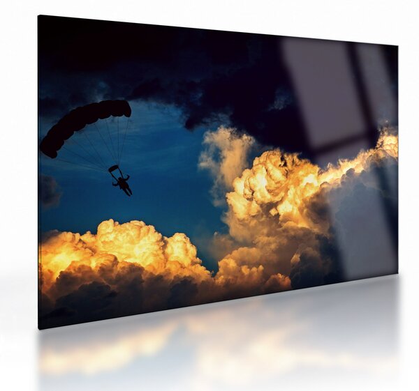 Obraz na szkle skoczka spadochronowego w chmurach (70x50 cm)
