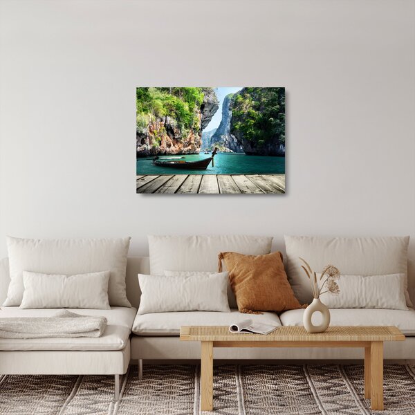 Obraz na szkle długiej łodzi na plaży (70x50 cm)