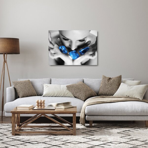Obraz na szkle portretu kobiety z kamieniami (70x50 cm)