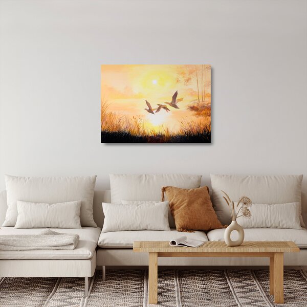 Obraz na szkle - Żurawie o zachodzie słońca (70x50 cm)