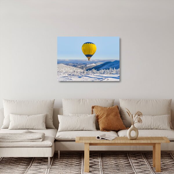 Obraz na szkle - Lot nad zimowym krajobrazem (70x50 cm)