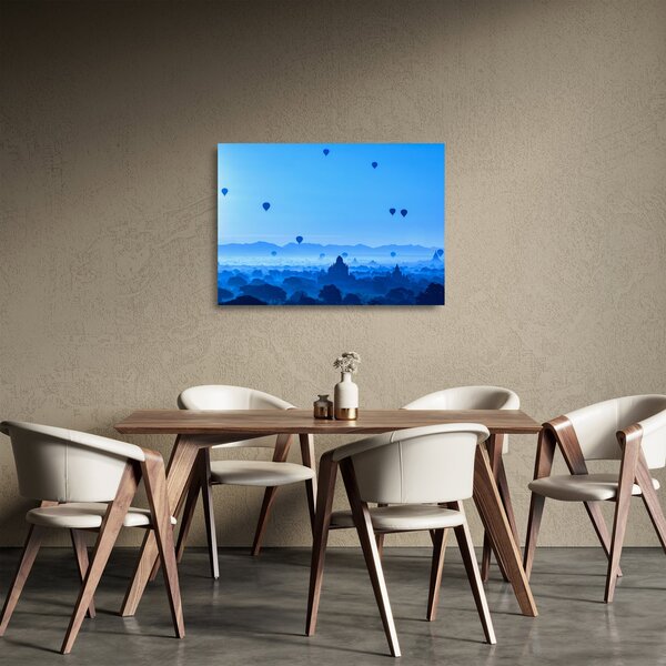 Obraz na szkle - Balony nad krajobrazem (70x50 cm)