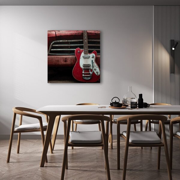 Obraz czerwona gitara przed samochodem