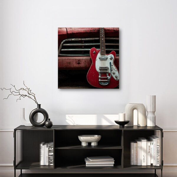 Obraz czerwona gitara przed samochodem