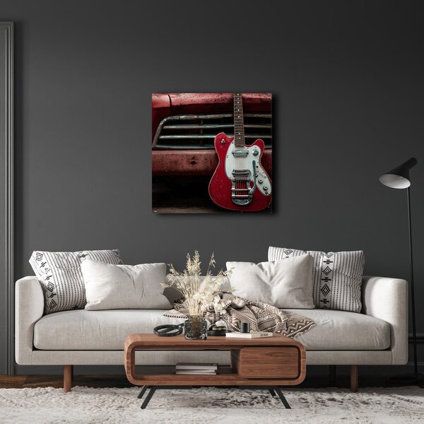 Obraz czerwona gitara przed samochodem
