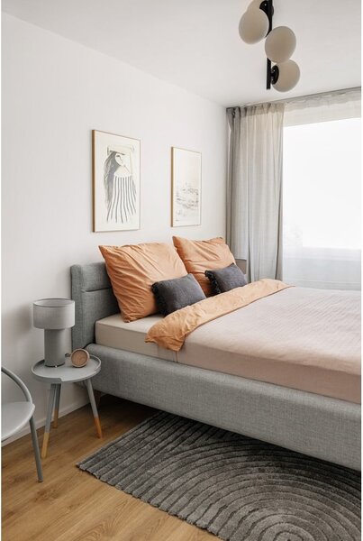 Szaroniebieskie tapicerowane łóżko dwuosobowe ze schowkiem ze stelażem 180x200 cm Lotte – Meise Möbel
