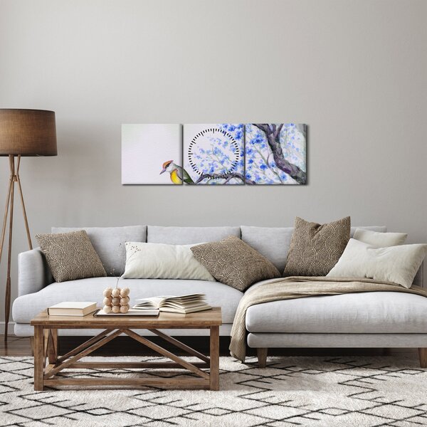 Obraz - ptak na drzewie z niebieskimi kwiatami (z zegarem) (90x30 cm)