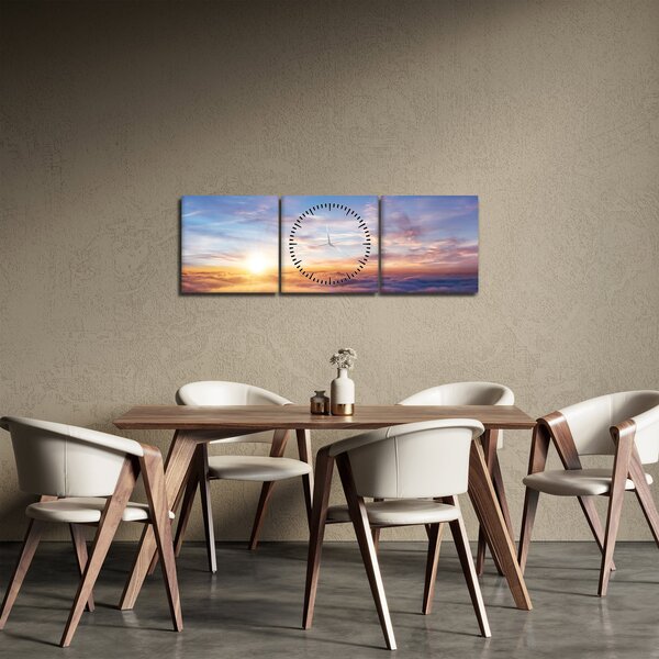 Obraz - Zachód słońca ponad chmurami (z zegarem) (90x30 cm)