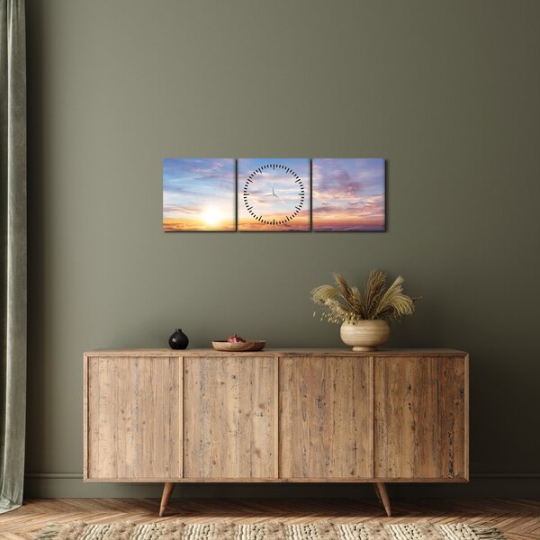 Obraz - Zachód słońca ponad chmurami (z zegarem) (90x30 cm)