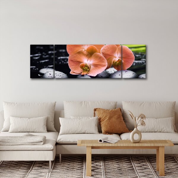 Obraz - Pomarańczowa orchidea z liśćmi palmy (170x50 cm)
