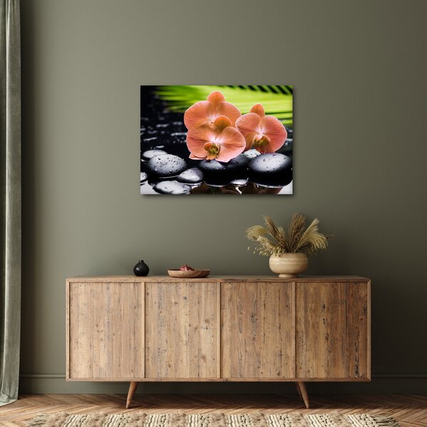 Obraz - Pomarańczowa orchidea z liśćmi palmy (70x50 cm)