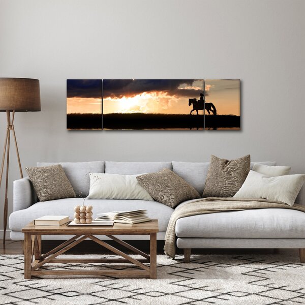 Obraz - Jeździec na koniu o zachodzie słońca (170x50 cm)