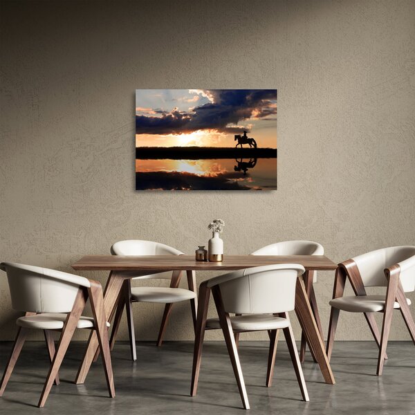 Obraz na szkle - Jeździec na koniu o zachodzie słońca (70x50 cm)