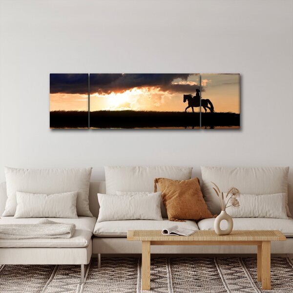Obraz - Jeździec na koniu o zachodzie słońca (170x50 cm)