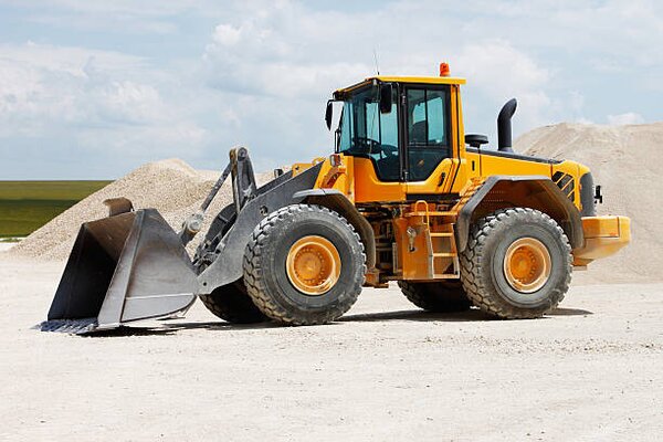 Ilustracja Yellow front loader at gravel pits, jordan_rusev