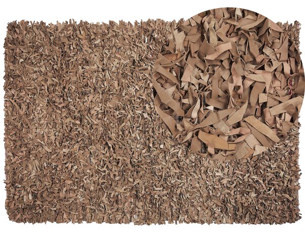 Ręcznie tkany dywan skórzany shaggy 160 x 230 cm beżowy Mut Beliani