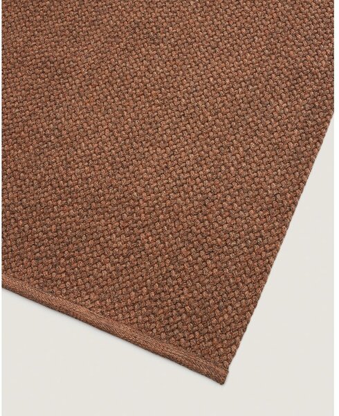 Dywan odpowiedni na zewnątrz z włókien z recyklingu w kolorze terakoty 160x230 cm Despas – Kave Home