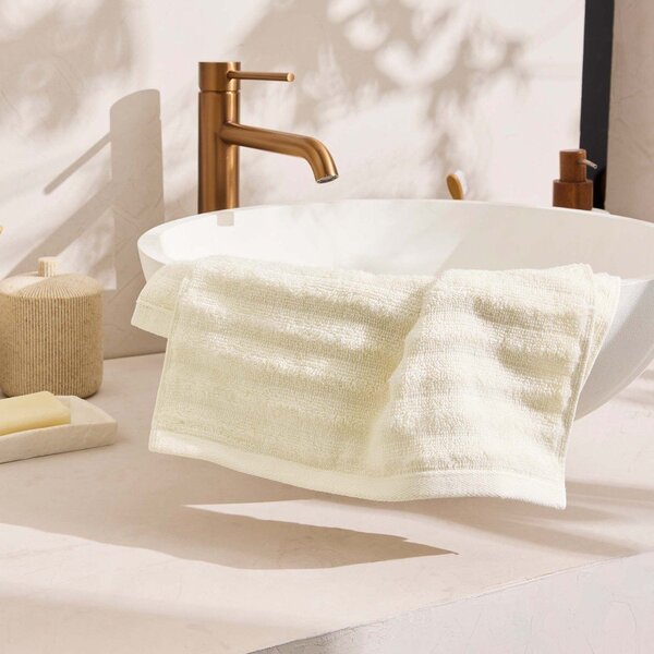 Kremowy bawełniany ręcznik frotte 30x50 cm Maya – douceur d'intérieur